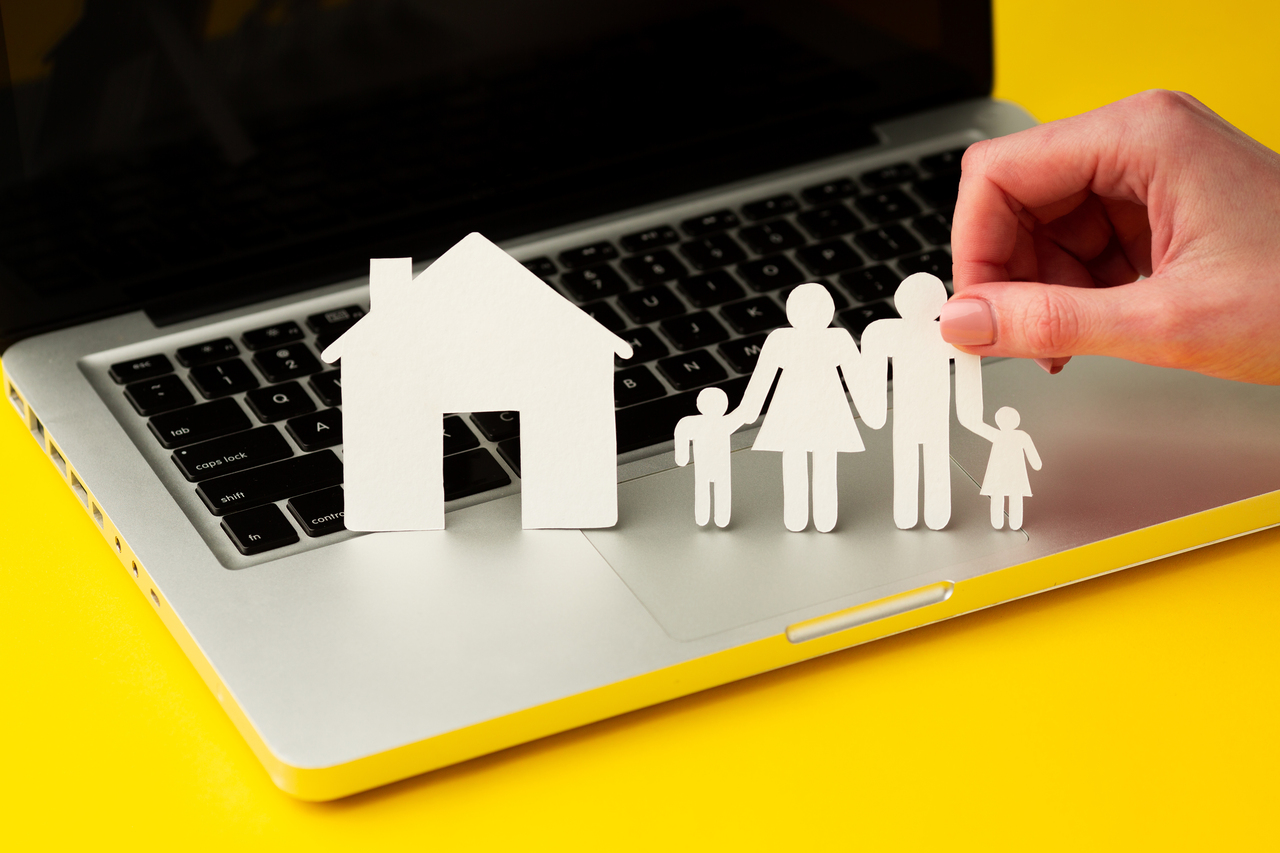 hand-holding-paper-cut-family-figure.jpg